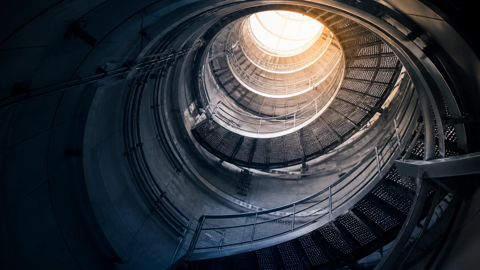 Fictional industrial spiral access stair viewed from below